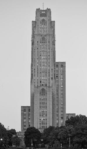 A neogothic skyscraper set against a grey sky.